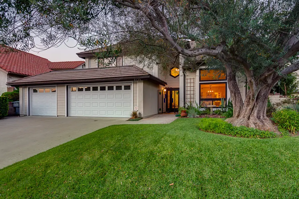 A two-garage home beneath an olive tree in Glendale